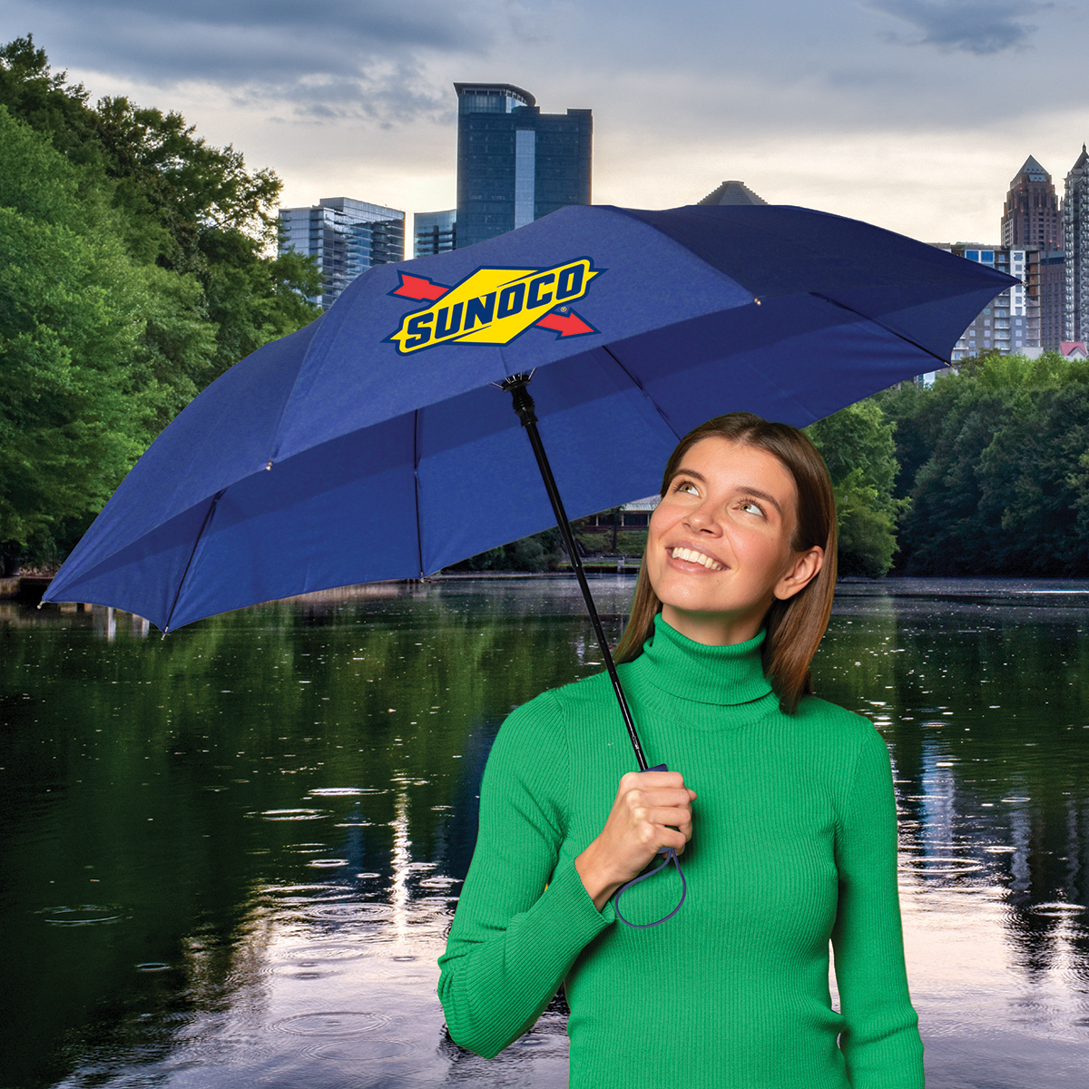 picture of woman with a blue umbrella with a logo on it